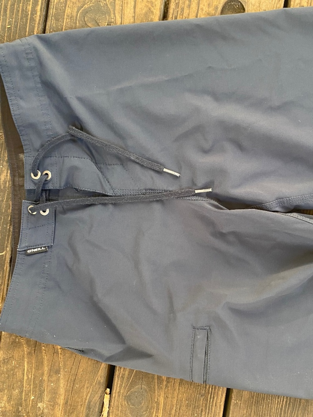 O’Neill brand board shorts size 27, navy blue, Junior Guards swim trunks